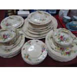A Royal Doulton Part Dinner Service, in the 'Henley' pattern, with sprays of flowers on a cream
