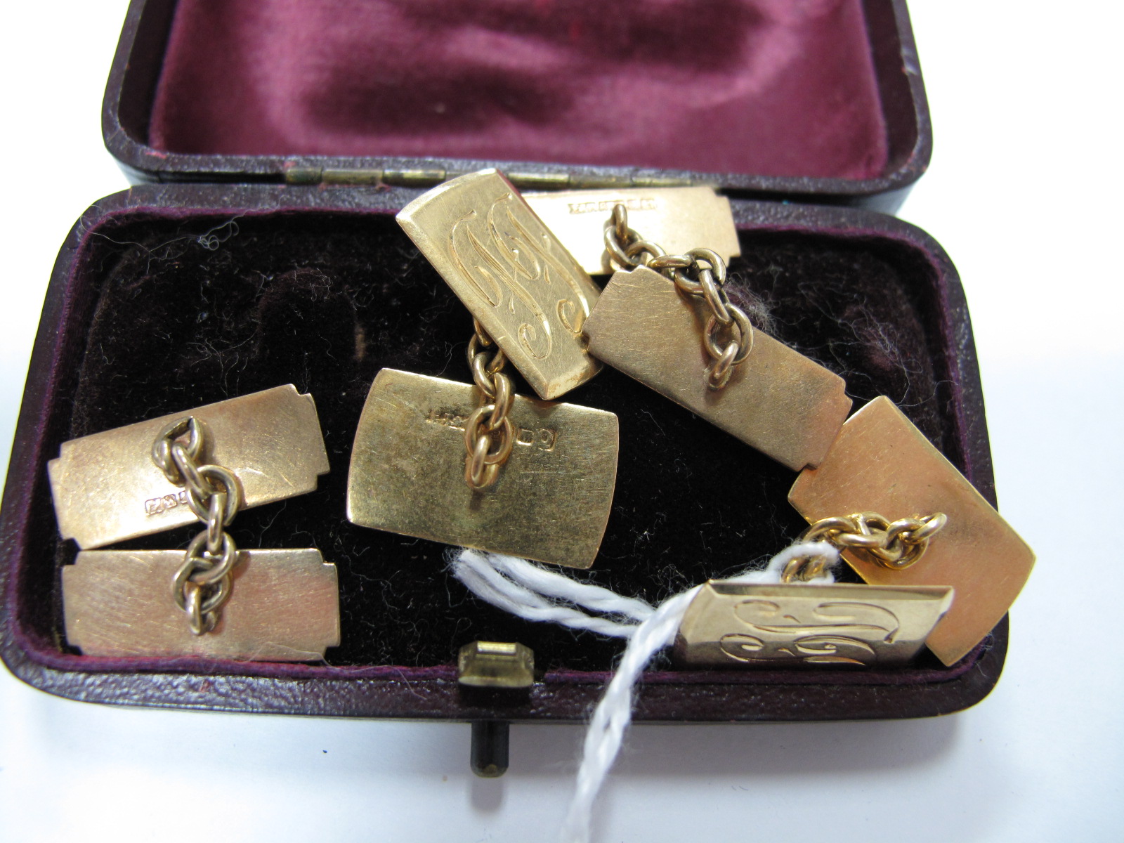 A Pair of Gent's Cufflinks, the rectangular panels on chain connections, initialled, stamped "18ct";