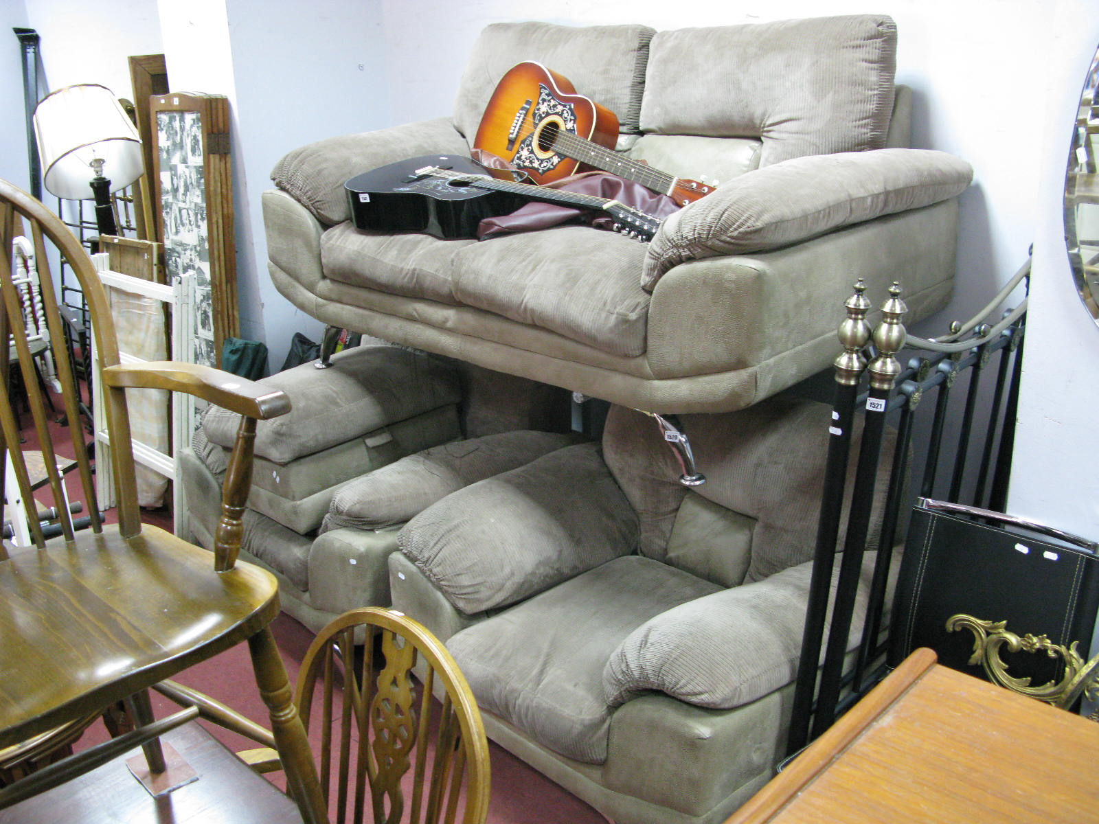 A Three Piece Lounge Suite, comprising two seater sofa and two armchairs, all on chrome splayed