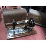 A Domed Cased Singer Sewing Machine, and one other. (2)