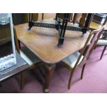 A 1920's Mahogany Extending Dining Table, with wind out action, spare leaf, on cabriole legs,