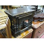 A Nest of Oak Coffee Tables, each with knulled apron, on turned and block supports.