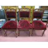 Three Edwardian Walnut Salon Chairs, each with pokerwork, carved top rail, spindle supports on