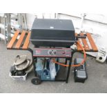 A Pro Chef Gas Barbecue; together with a box of tools and a box of cast iron wheels.