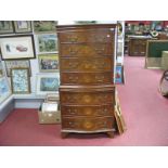 A Reprodux Walnut Serpentine Shaped Chest on Chest, top with two short and three long drawers,