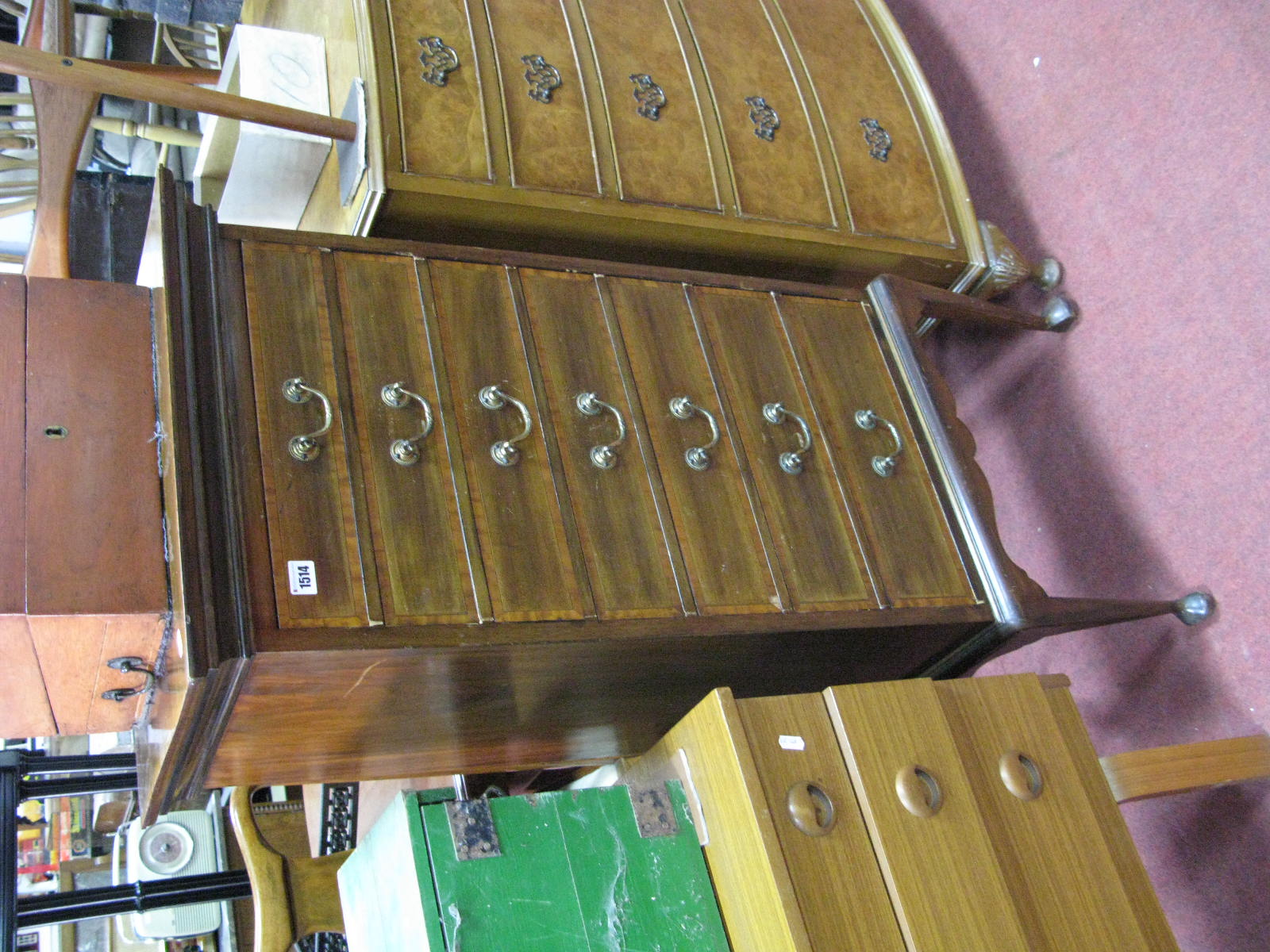 An Edwardian Inlaid Mahogany Music Cabinet, with brass handles to seven fall front drawers, on
