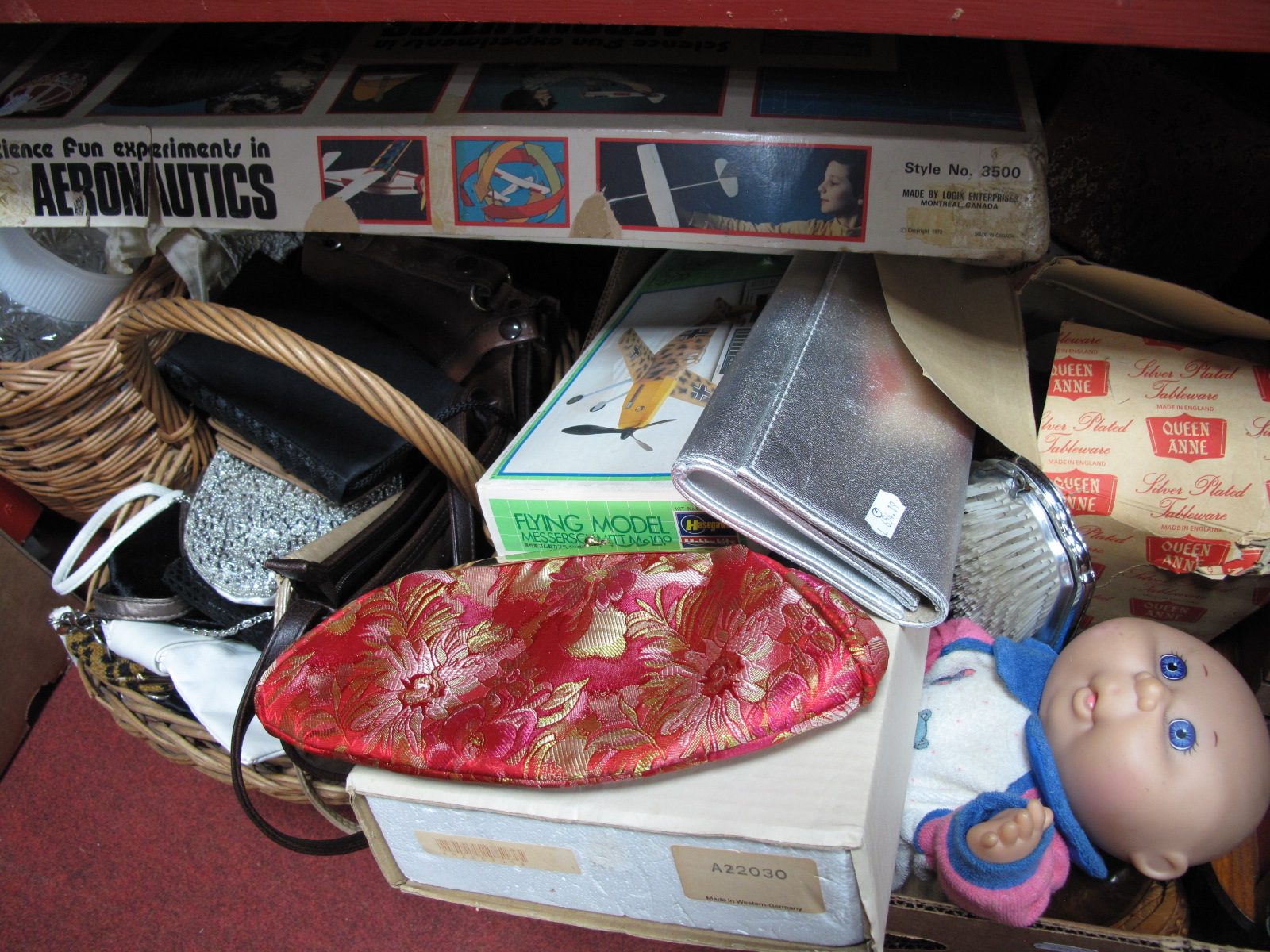 Wicker Baskets, ladies evening bags/purses, barometer, plastic kit, 'Aeronautics' kit, bookends,