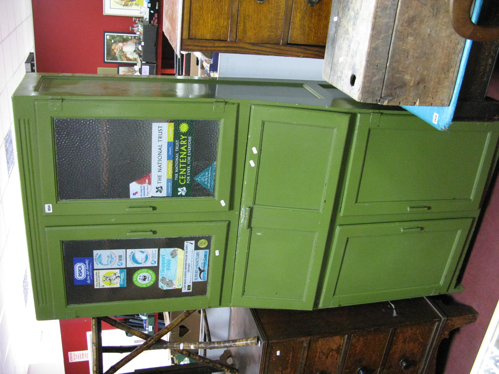 A Green Painted Kitchen Cabinet, circa mid XX Century with glazed doors, fall front over twin doors,