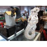 A Painted Wooden Horse, 71cm high, and carved wooden Indian mermaid wall hanging. (2)