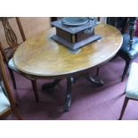 A XIX Century Walnut Loo Table, with satinwood vase inlay to oval top, on four pillar supports,