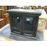 An Ebonised and Gilt Table Top Display Cabinet, with stepped top, 43.5cm wide.