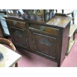 A Walnut Sideboard, with Art Nouveau stylised carving to twin doors, 135cm wide.