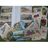 A Quantity of Vintage Postcards and Greetings Cards, sometimes in an album.