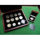 A 2011 Silver Britainnia G.B. Two Pounds Coin, nine TDC one crown commemorative coins, including