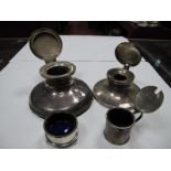 A Hallmarked Silver Capstan Style Inkwell, (damaged) together with an EPNS example and a