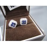 A Pair of 9ct White Gold Diamond and Sapphire Cluster Stud Earrings, ACS insurance value £650.