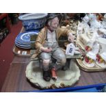 A Bruno Merli Capodimonte Figure, of a seated tramp, 22.5cm high.