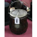 An Oak Biscuit Jar, with electroplated lid, swing handle and shield cartouche.