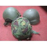 Two Late XX Century British Kevlar Helmets, one with camo cover and an Armoured Vehicle