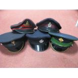 Five ER II Military Caps, all with cap badges including Welsh Guards and Royal Tank Regiment.