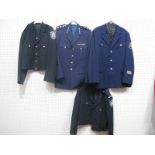 Four Late XX Century Police Tunics, one German, two Canadian, all with buttons and insignia and