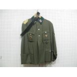 A Replica Nazi Officers Tunic and Breeches, with all insignia and badges including "Adolf Hitler"