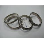 Four Hallmarked Silver Bangles, hinged to snap clasp each with engraved decoration. (4)