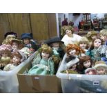 A Collection of Over Twenty Five Modern Porcelain Dolls, varying sizes and costumes:- Three Boxes