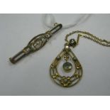 An Edwardian Style Openwork Pendant, circular collet set to the centre, on a chain; together with an