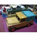 A Large Wooden Model Land Rover, detachable covered rear seating, length 51cm, a modern tinplate