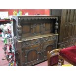 A XX Century Oak Court Cupboard, the upper with arched panel and cup and cover supports, two small