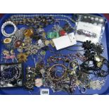 A Mixed Lot of Assorted Costume Jewellery, including beads, bracelets, brooches, etc:- One Tray