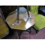 An Edwardian Walnut Octagonal Shaped Table on turned legs, with under shelf.