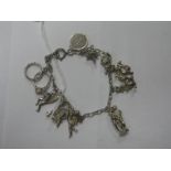 A Dainty Charm Bracelet, suspending figural and other novelty charm pendants.
