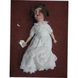 A German Bisque Headed Doll, stamped 21, sleepy eyes, open mouth with teeth, fully jointed