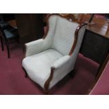 An Early XX Century Mahogany Armchair, with a shaped top rail, upholstered back and seat, on