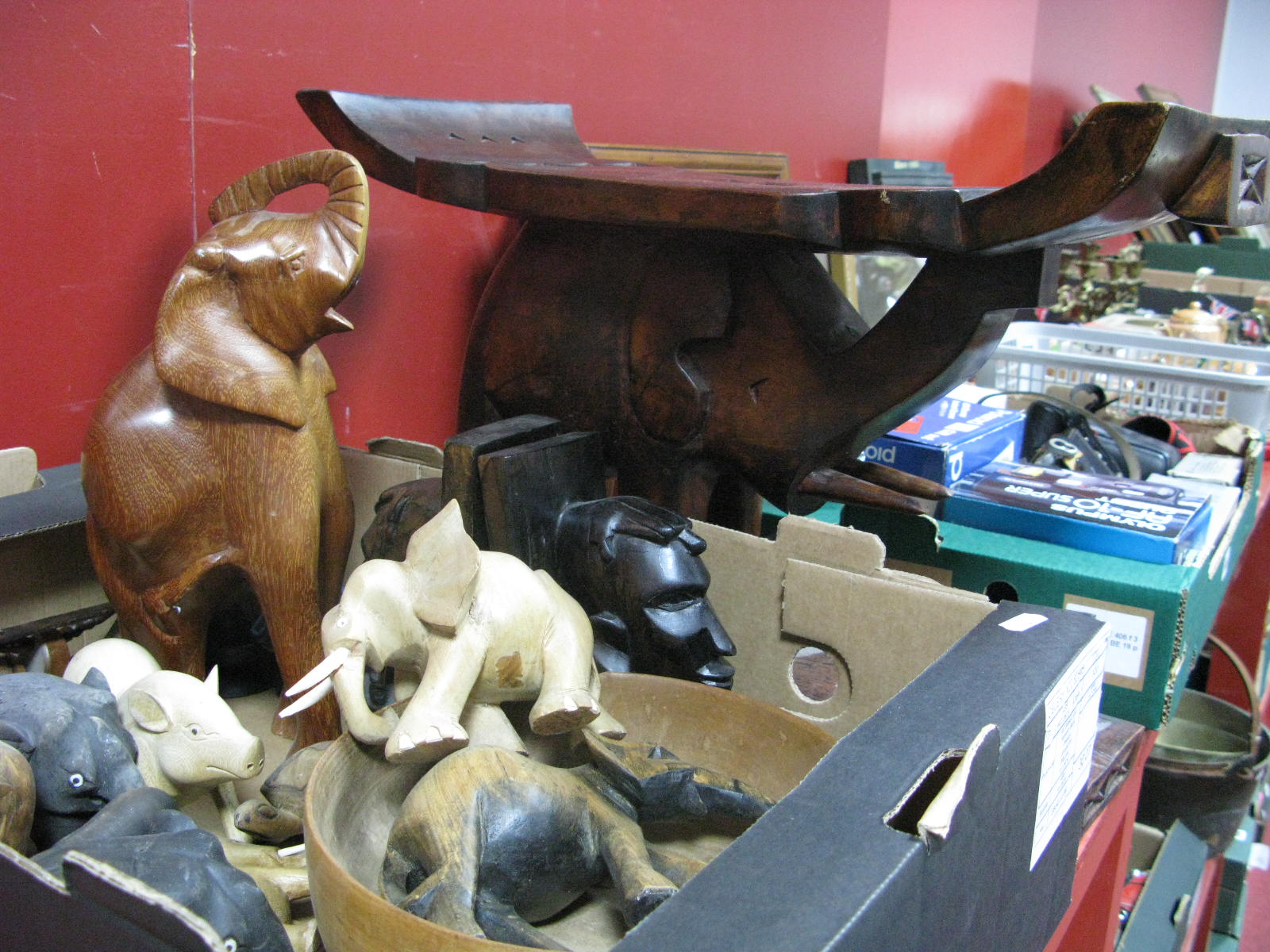 An African Carved Elephant in the Form of a Seat; together with a box of carved elephants.