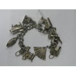 A Double Curb Link Charm Bracelet, (lacking clasp) suspending nine assorted novelty charm pendants