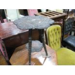 Indian Hardwood Coffee Table, with extensive carving of figures and foliage to rounded hexagonal top