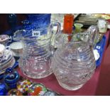 An Early XIX Century Cut Glass Water Jug, horizontally slice cut with a central prism cut band and