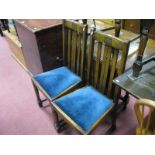 A 1920's Oak Drop Leaf Table, on barleytwist supports; together with a set of four oak dining