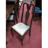 A Set of Four Queen Ann Style Dining Chairs, with drop in seats, on cabriole legs.