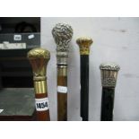 Early XX Century Walking Sticks, with white and yellow metal pommels. (4)