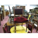 Three Edwardian Walnut Salon Chairs, each with pokerwork, carved top rail, spindle supports on