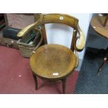 A Bentwood Elbow Chair, with a low back, shaped arm supports on circular legs with stretchers.