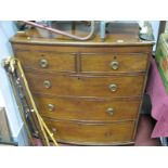 A XIX Century Mahogany Bow Fronted Chest of Drawers, with two short drawers, three long drawers (