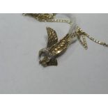 A 9ct Gold Eagle Pendant, on fine trace link chain hallmarked to the clasp.