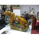 A Mid XX Century Painted Plaster Model of a Roaring Lion on Rocky Base, length 53cm and a majolica