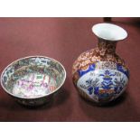 A Chinese Cantonese Bowl and an Imari pattern vase. (2)