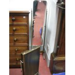 A XX Century Mahogany Cheval Mirror, with finial tops tapering supports, rectangular mirror, on